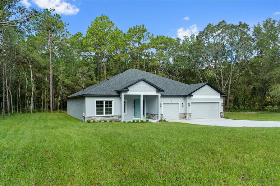 Front exterior of a new home in , Lecanto, FL, highlighting curb appeal (Image 2). Front exterior of a new home in , Lecanto, FL, highlighting curb appeal (Image 2).