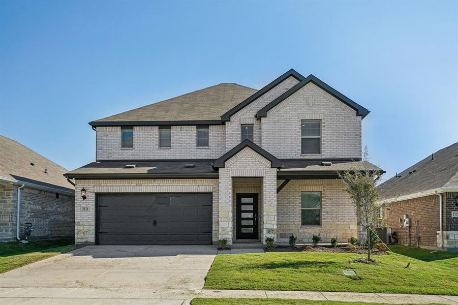 Front exterior of a new home in Stonehaven, Seagoville, TX, highlighting curb appeal (Image 1). Front exterior of a new home in Stonehaven, Seagoville, TX, highlighting curb appeal (Image 1).