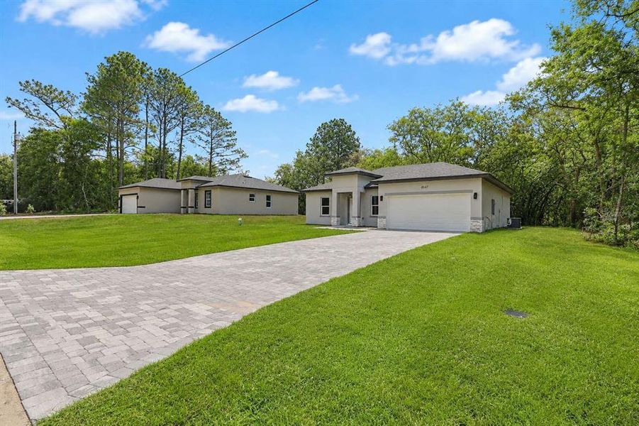 Front exterior of a new home in , Citrus Springs, FL, highlighting curb appeal (Image 19).