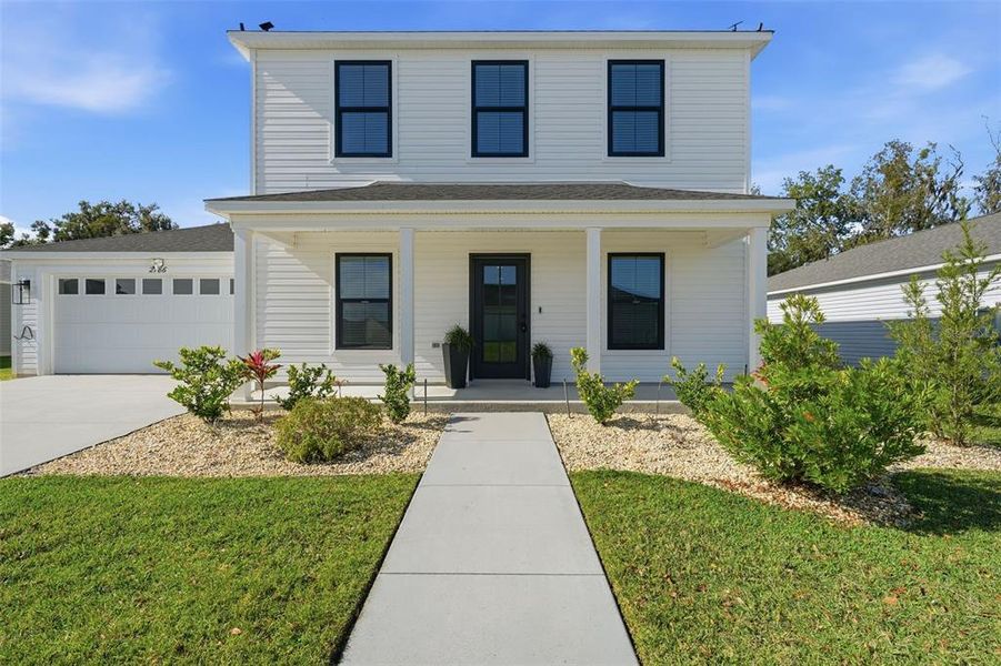 Front exterior of a new home in , Okahumpka, FL, highlighting curb appeal (Image 2). Front exterior of a new home in , Okahumpka, FL, highlighting curb appeal (Image 2).
