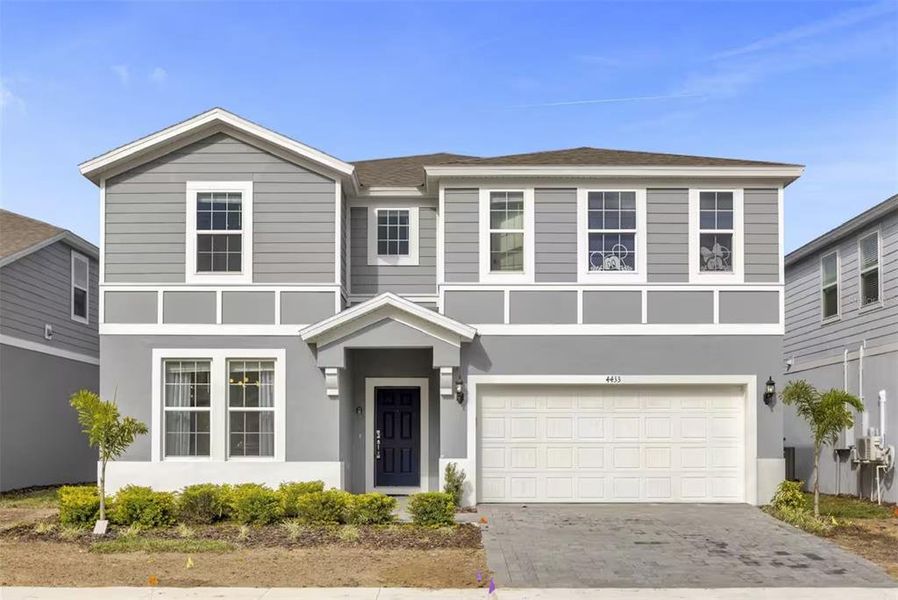 Front exterior of a new home in , Davenport, FL, highlighting curb appeal (Image 1).