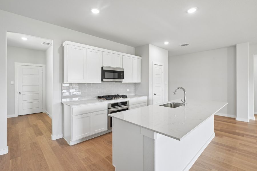 Kitchen in the Heisman home plan by Trophy Signature Homes Kitchen in the Heisman home plan by Trophy Signature Homes