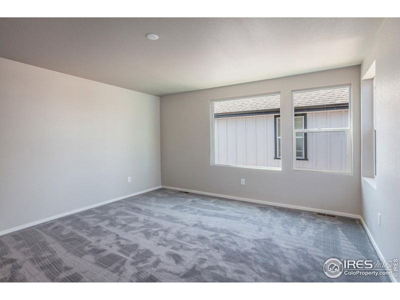 Spacious, unfurnished interior of a new home in Trailside Alley Load - Single Family Homes, Timnath (Image 29).