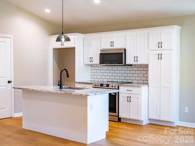 Furnished interior view inside a new home in , Waynesville (Image 4).