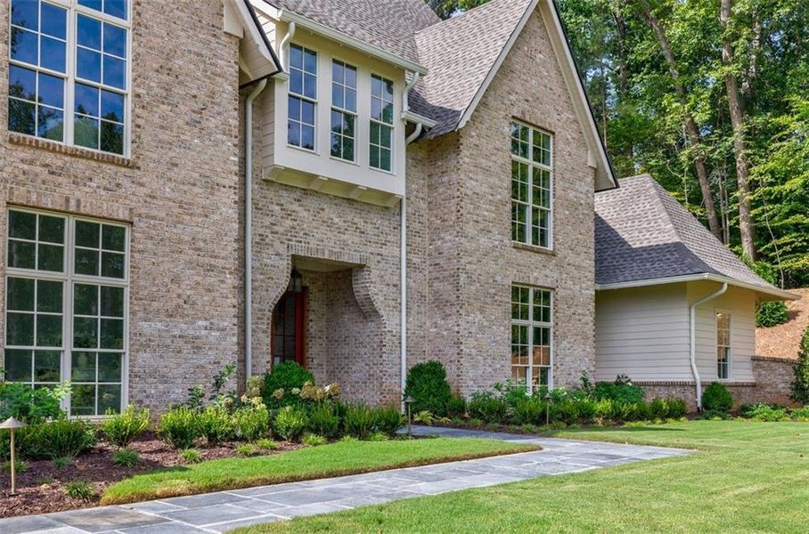 Front exterior of a new home in , Canton, GA, highlighting curb appeal (Image 1).
