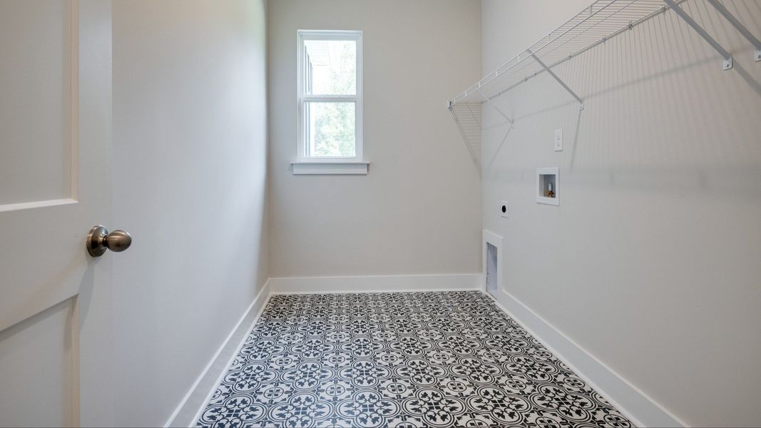 Laundry room with timeless tile designing on floor
