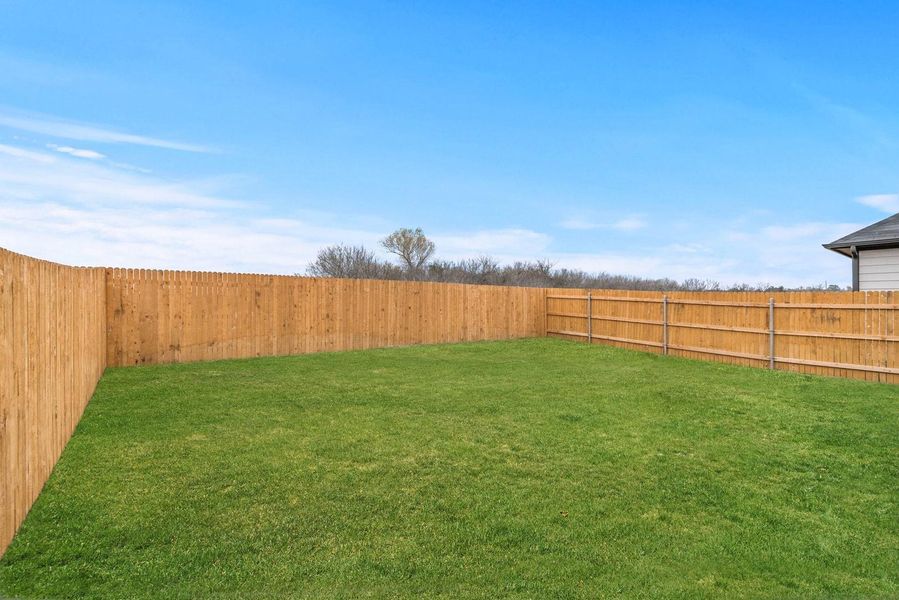 Exterior details and patio area of a home in Trinity Ranch, Elgin (Image 21).