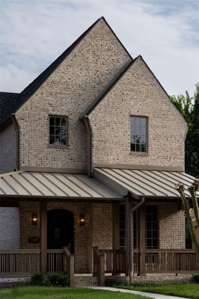 A close up of the modular brick and hand stained beams and porch railing. A close up of the modular brick and hand stained beams and porch railing.