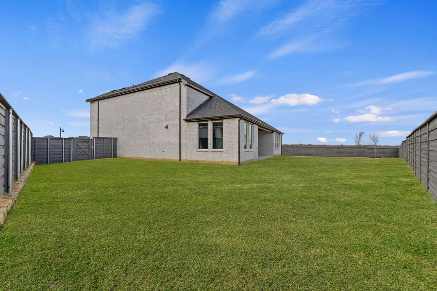 Exterior details and patio area of a home in Union Park, Little Elm (Image 20).