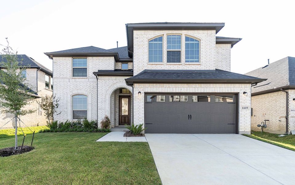 Front exterior of a new home in La Terra, Celina, TX, highlighting curb appeal (Image 2).