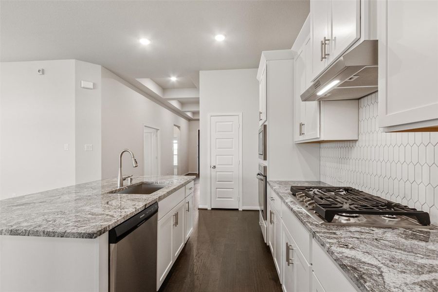 Furnished interior view inside a new home in Sunterra, Katy (Image 10).