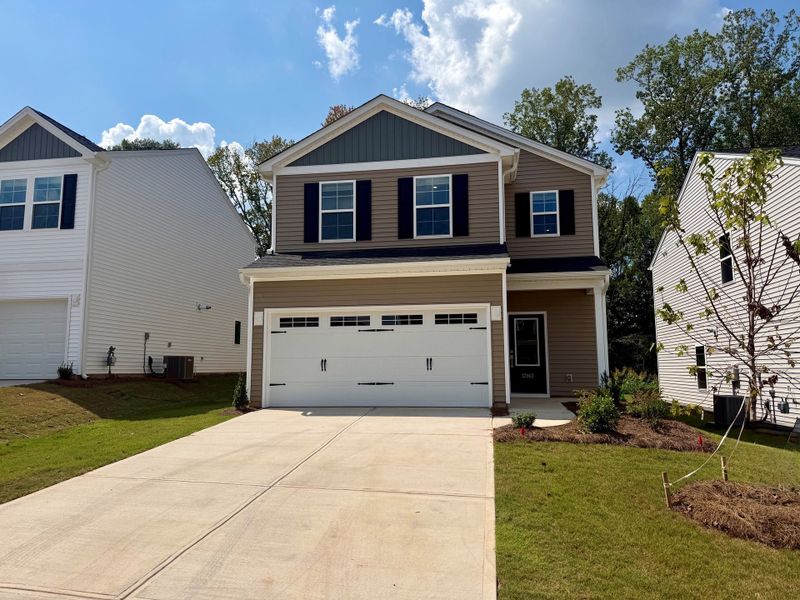 Front exterior of a new home in Richmond Hill, Inman, SC, highlighting curb appeal (Image 2). Front exterior of a new home in Richmond Hill, Inman, SC, highlighting curb appeal (Image 2).