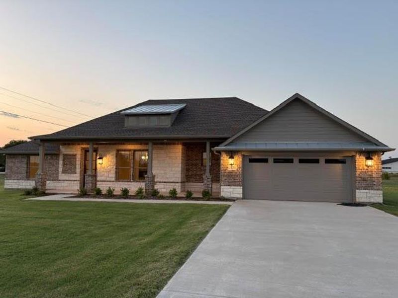 Front exterior of a new home in , Van Alstyne, TX, highlighting curb appeal (Image 22). Front exterior of a new home in , Van Alstyne, TX, highlighting curb appeal (Image 22).