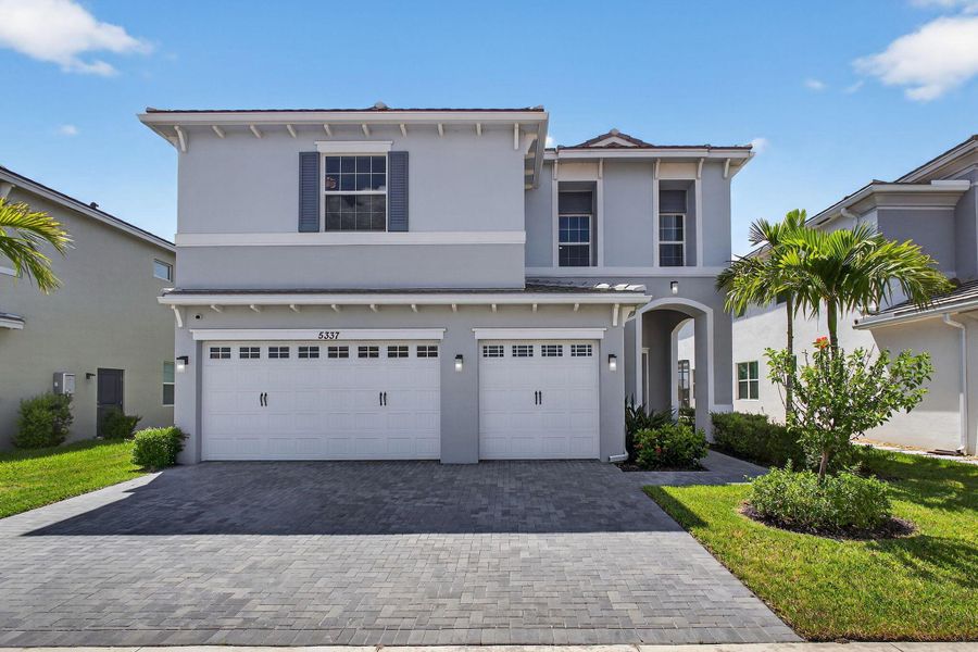 Front exterior of a new home in , The Acreage, FL, highlighting curb appeal (Image 28).