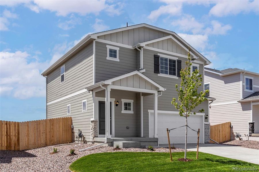 Front exterior of a new home in Bennett Ranch, Bennett, CO, highlighting curb appeal (Image 14).