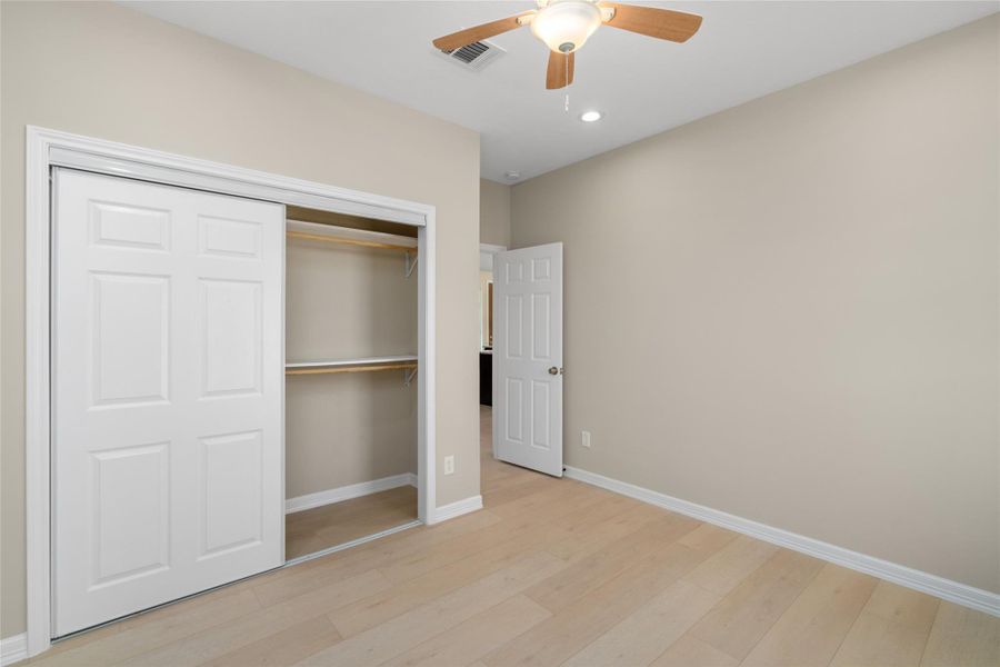 Spacious bedroom with generous closet space and a clean, modern palette. A perfect canvas for any style.