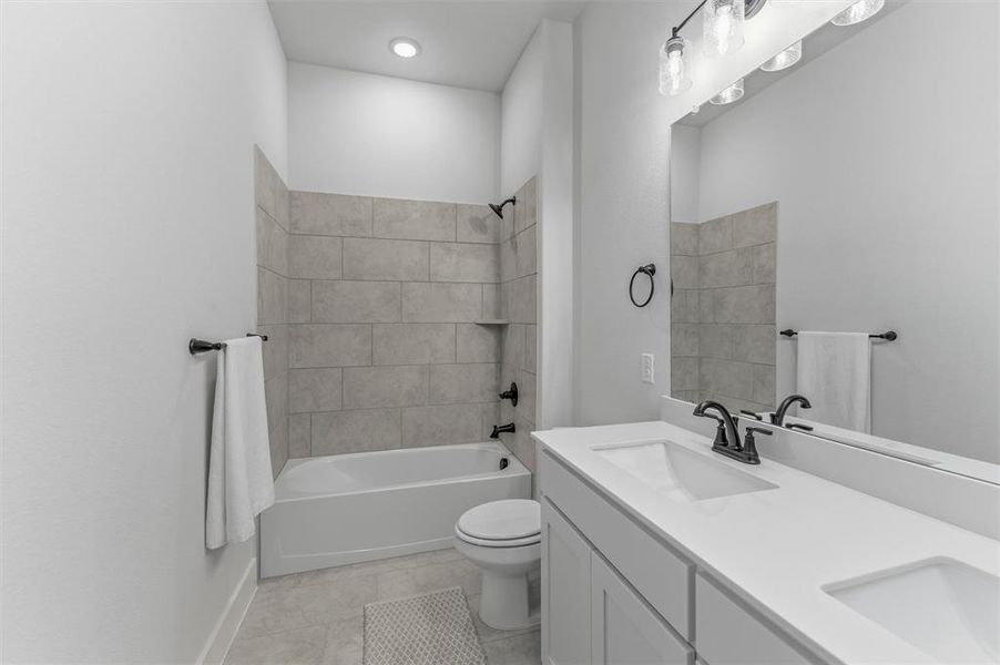 Contemporary bathroom featuring a dual-sink vanity with a white countertop and matte black fixtures