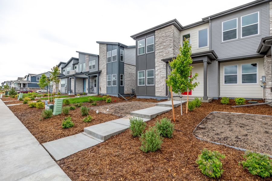 Front exterior of a new home in Painted Prairie, Aurora, CO, highlighting curb appeal (Image 23).