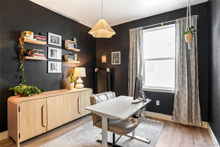 Dedicated home office with designer finishes and natural light, creating an inspiring work-from-home space in this Morrison Colorado home