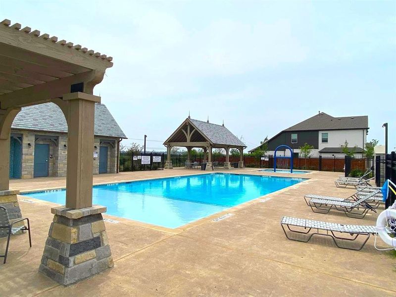 Community pool featuring a patio