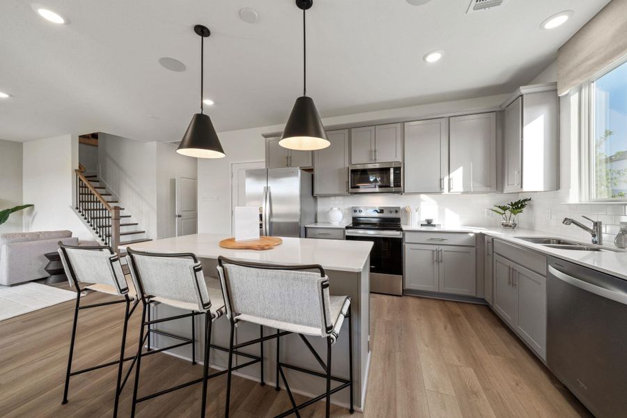 Photo of Pulte model home with same floor plan, not of actual home listed.