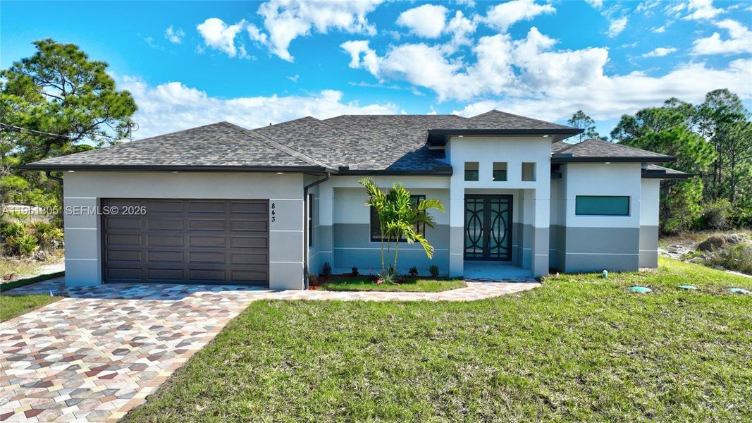 Front exterior of a new home in , Lehigh Acres, FL, highlighting curb appeal (Image 30). Front exterior of a new home in , Lehigh Acres, FL, highlighting curb appeal (Image 30).