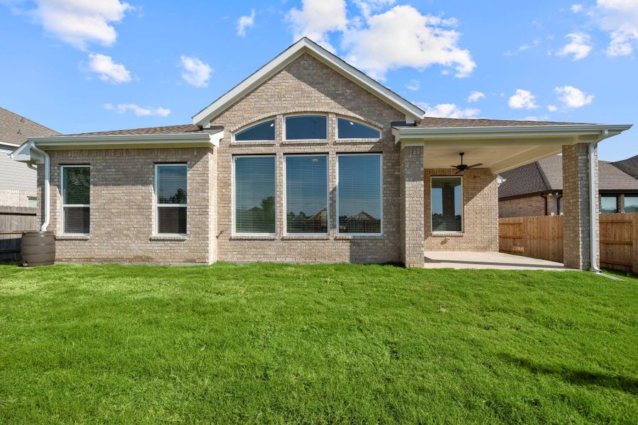 Exterior details and patio area of a home in Artavia, Conroe (Image 3).