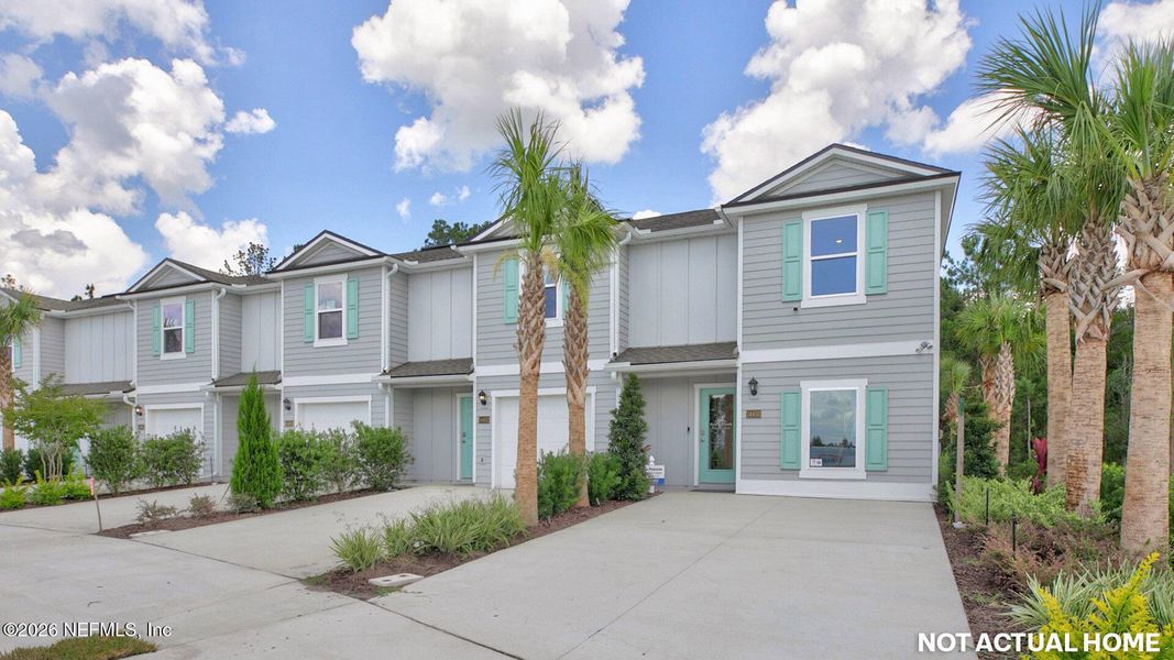Front exterior of a new home in Bridle Creek, Jacksonville, FL, highlighting curb appeal (Image 1). Front exterior of a new home in Bridle Creek, Jacksonville, FL, highlighting curb appeal (Image 1).