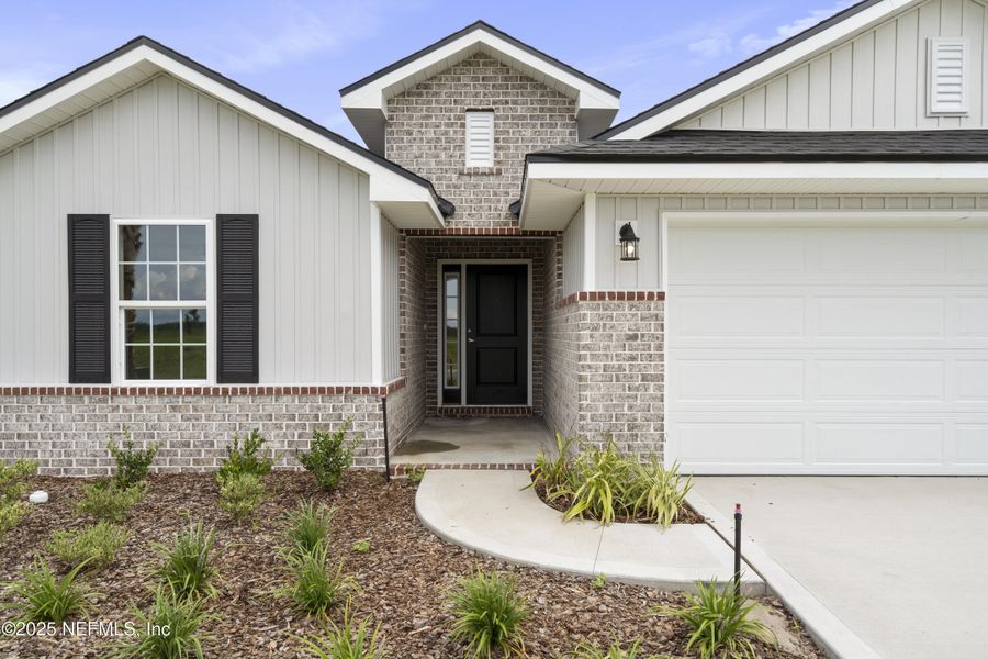 Front exterior of a new home in Shadow Crest at Rolling Hills, Green Cove Springs, FL, highlighting curb appeal (Image 15).