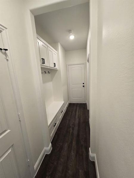 Corridor featuring dark hardwood / wood-style floors