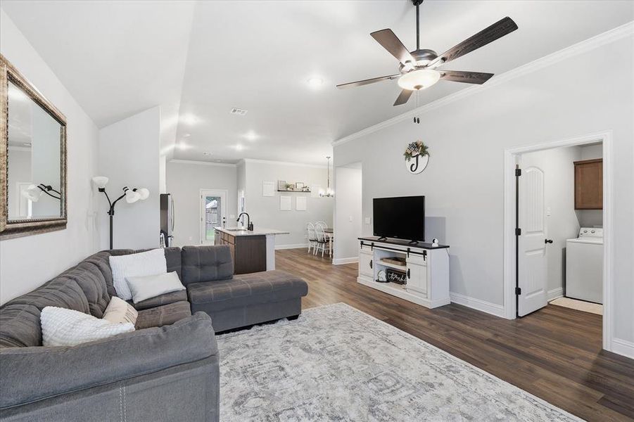 Open-concept living and kitchen area offering a bright, connected space perfect for everyday living and entertaining.