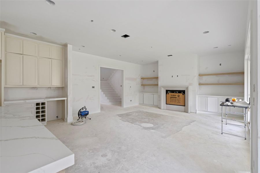 Custom shelving and cabinets on either side of the fireplace in the living room. Custom shelving and cabinets on either side of the fireplace in the living room.