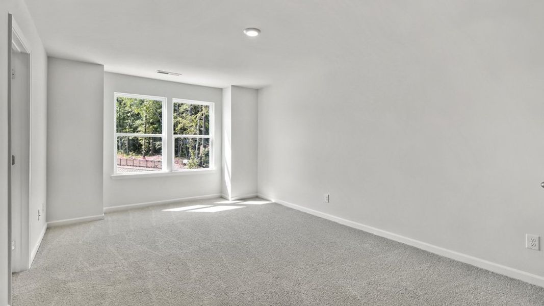 Spacious, unfurnished interior of a new home in The Gables at Edinborough Townes, Gibsonville (Image 14).