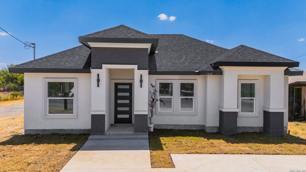 Front exterior of a new home in , Eagle Pass, TX, highlighting curb appeal (Image 21).