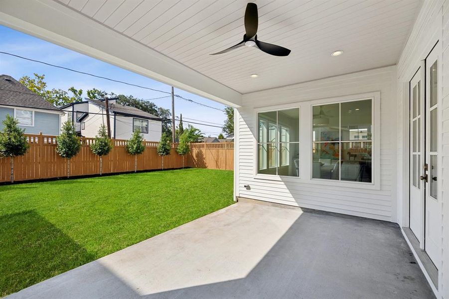 Covered patio overlooking a fabulous backyard!