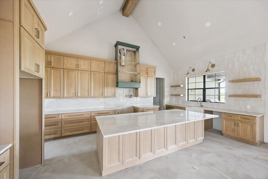 Spacious kitchen with 10' island.  Bosch appliances coming soon.  Natural Quartzite counters.