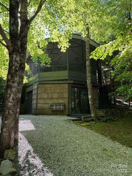 View from the back of the screened porch, bedroom and garage