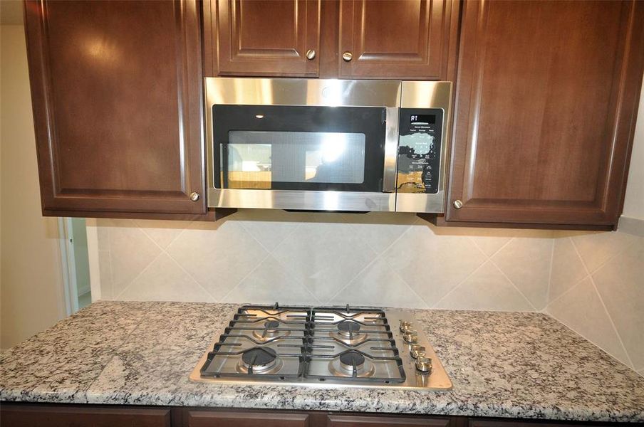 Gas cooktop and microwave