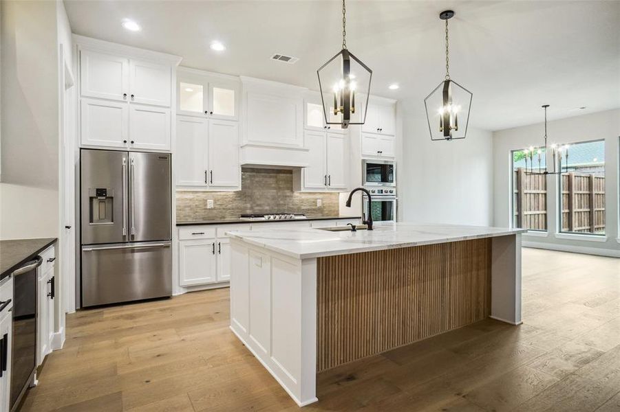 Love the stained wood slatwork on the island front! Love the stained wood slatwork on the island front!