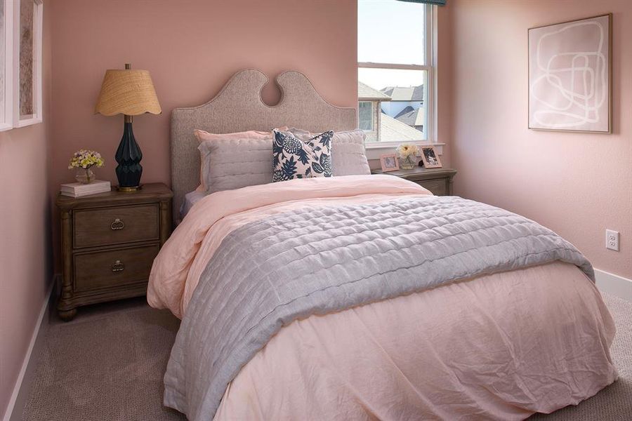 Carpeted bedroom with baseboards