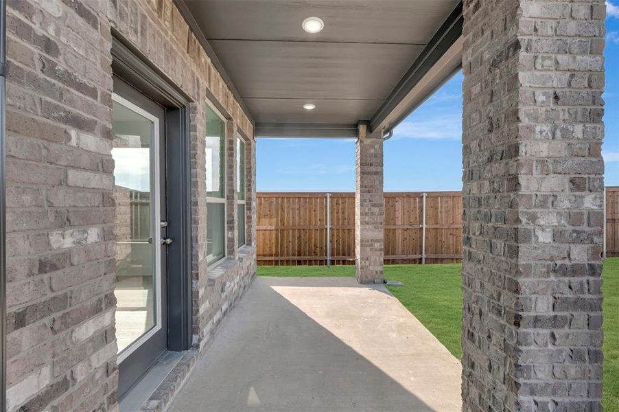 Exterior details and patio area of a home in Lily Creek at Sutton Fields, Aubrey (Image 3).