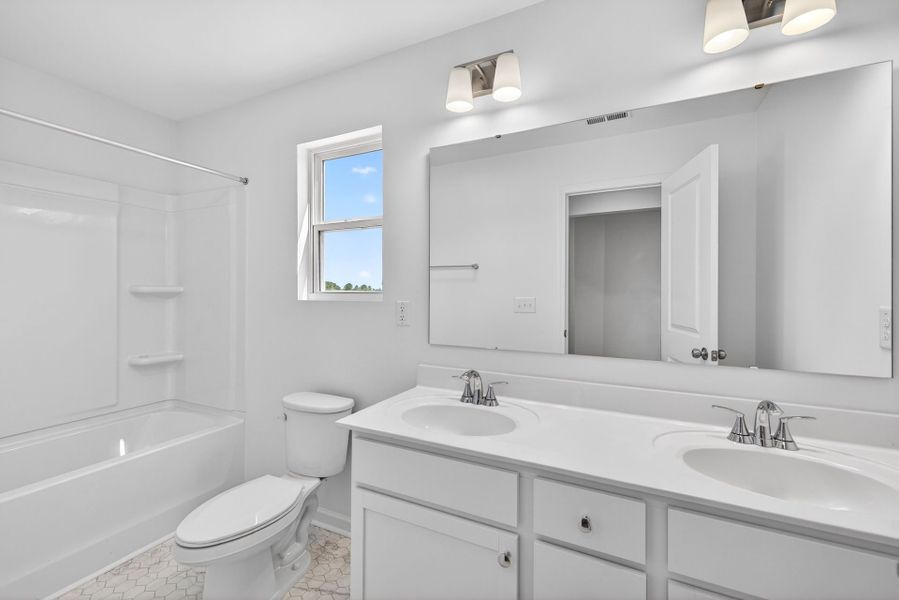 Furnished interior view inside a new home in White Oak Creek Crossing, Angier (Image 27).