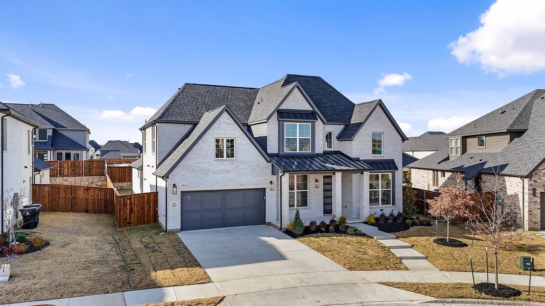 Front exterior of a new home in Estates at Rockhill, Frisco, TX, highlighting curb appeal (Image 28). Front exterior of a new home in Estates at Rockhill, Frisco, TX, highlighting curb appeal (Image 28).