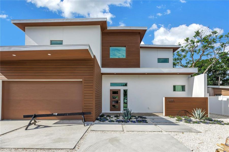 Front exterior of a new home in , Sarasota, FL, highlighting curb appeal (Image 1).