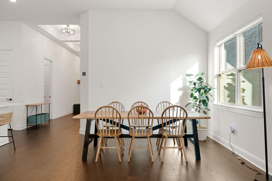 High vaulted ceilings in this inviting dining space. High vaulted ceilings in this inviting dining space.