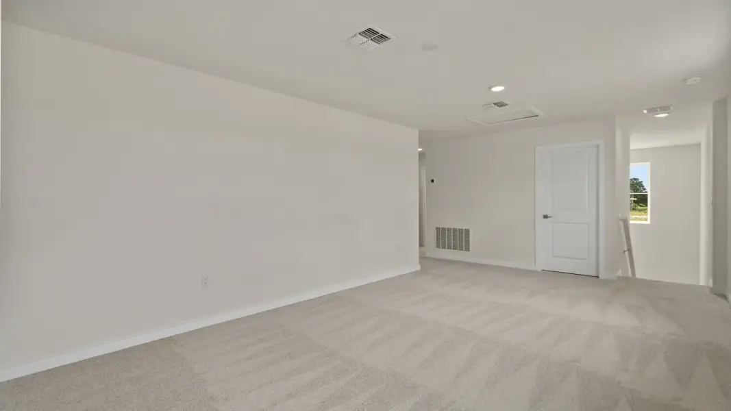 The Naples Second Floor Loft Space in Quick Move-In Home at Willowbrook North by DRB Homes in Winter Haven, FL