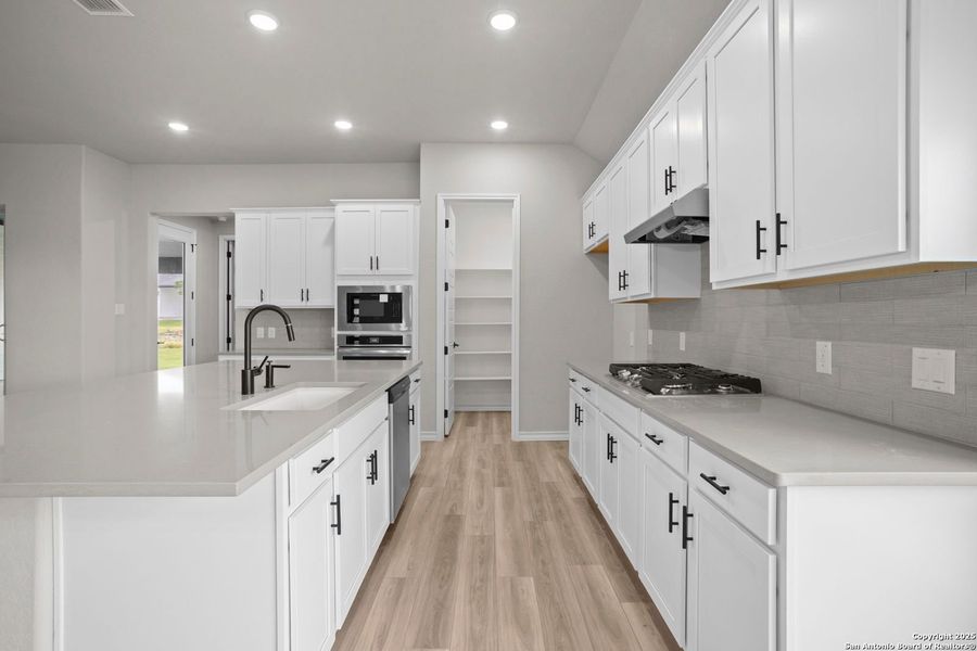 Furnished interior view inside a new home in Potranco Oaks, Castroville (Image 43).