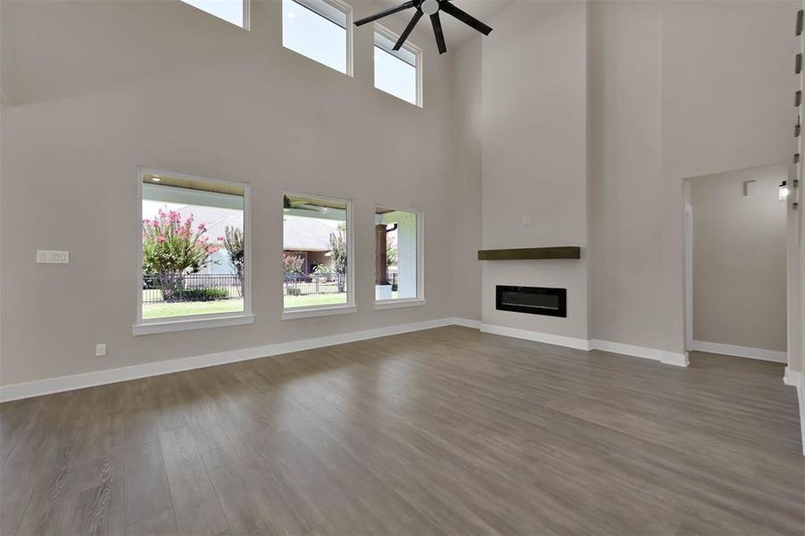 Similar 20ft Ceilings and Fire Place in Living Area Built By TX Best Home Builders