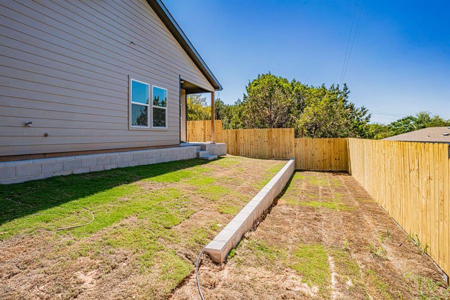 Terraced backyard with privacy fence