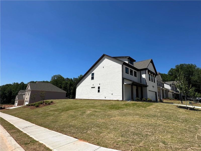 Front exterior of a new home in Summerlin, Winder, GA, highlighting curb appeal (Image 28).